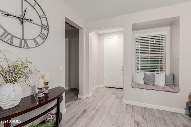 foyer entrance with light wood-type flooring
