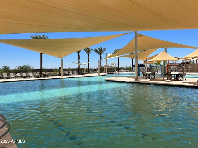 view of swimming pool with a patio area