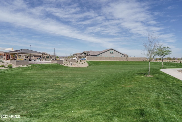 view of property's community with a lawn