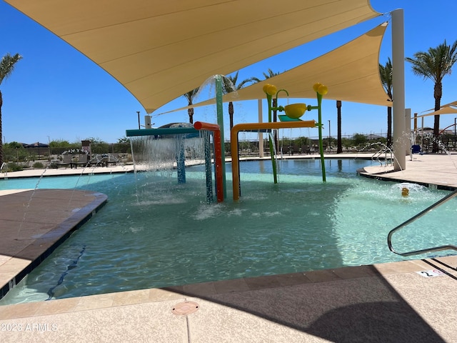 view of swimming pool featuring pool water feature