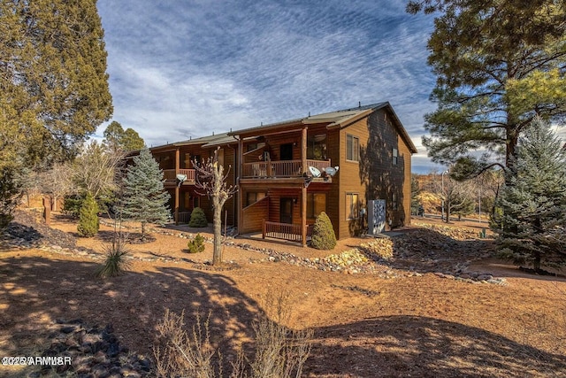 rear view of house featuring a balcony