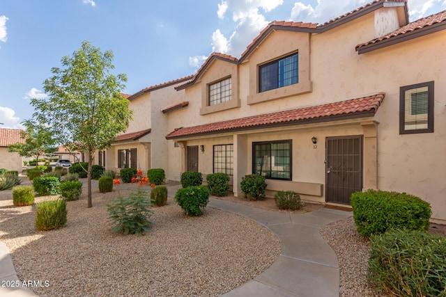 2941 N Oregon St Unit 12, Chandler, AZ 85225 - mediterranean / spanish house featuring a tiled roof and stucco siding
