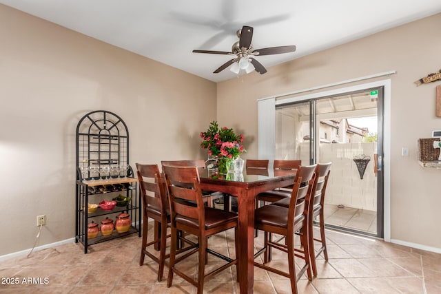 2941 N Oregon St Unit 12, Chandler, AZ 85225 - dining room featuring a ceiling fan, baseboards, and light tile patterned flooring