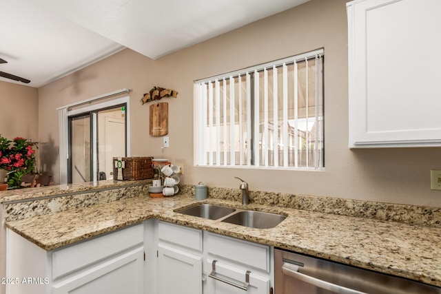 2941 N Oregon St Unit 12, Chandler, AZ 85225 - kitchen with dishwasher, a sink, white cabinets, and a peninsula