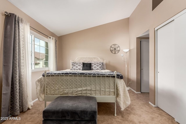 2941 N Oregon St Unit 12, Chandler, AZ 85225 - bedroom featuring carpet, vaulted ceiling, baseboards, and a closet