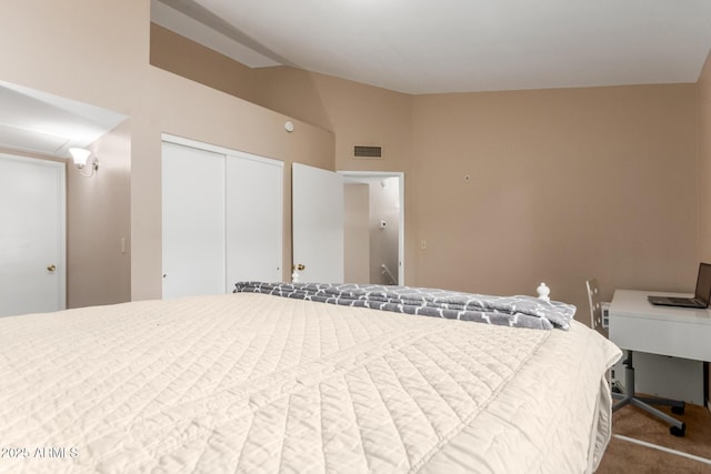 2941 N Oregon St Unit 12, Chandler, AZ 85225 - bedroom with vaulted ceiling, carpet flooring, and a closet