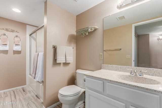 2941 N Oregon St Unit 12, Chandler, AZ 85225 - bathroom with vanity, toilet, shower / bath combination with glass door, wood finished floors, and baseboards