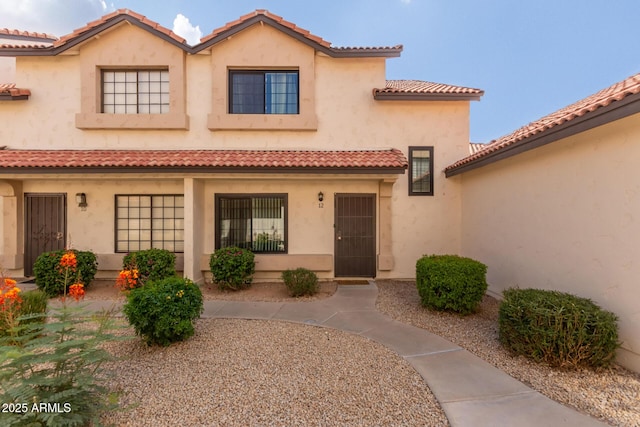 2941 N Oregon St Unit 12, Chandler, AZ 85225 - view of front of property with a tile roof and stucco siding