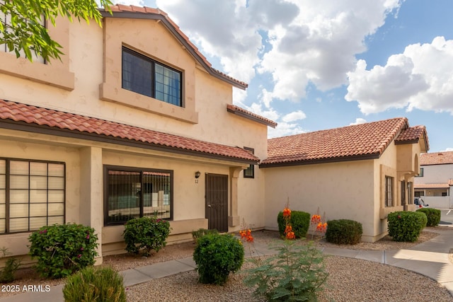 2941 N Oregon St Unit 12, Chandler, AZ 85225 - view of front of property with a tile roof and stucco siding