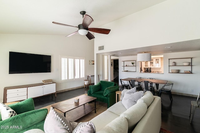 living room featuring ceiling fan, baseboards, visible vents, and high vaulted ceiling