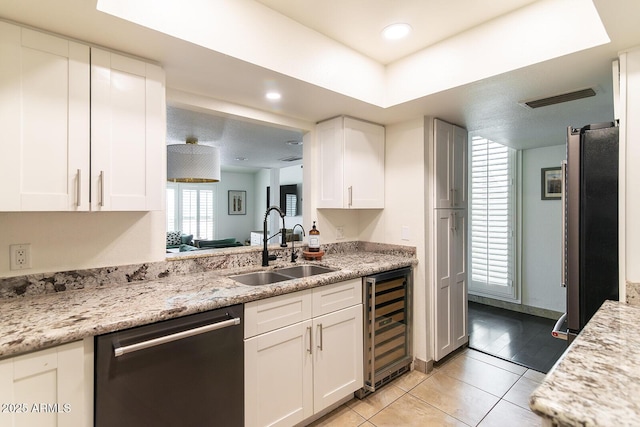 kitchen featuring visible vents, wine cooler, white cabinets, stainless steel appliances, and a sink