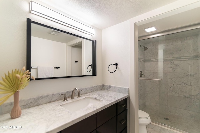 bathroom featuring visible vents, toilet, marble finish floor, and a shower stall