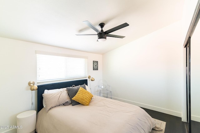 bedroom featuring baseboards and a ceiling fan