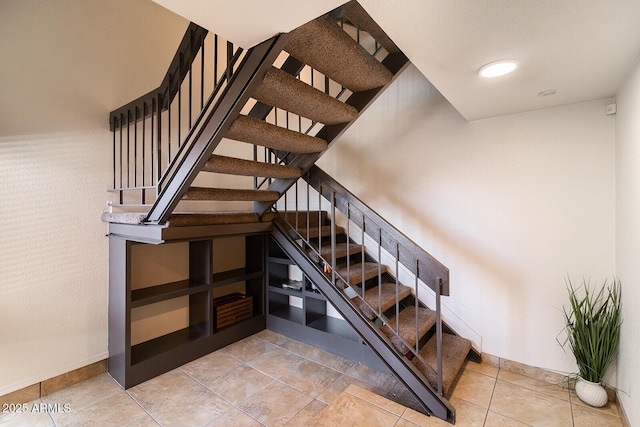 staircase with baseboards