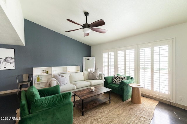 living room with wood finished floors, baseboards, ceiling fan, and vaulted ceiling