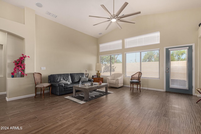 living room featuring ceiling fan, high vaulted ceiling, a wealth of natural light, and dark hardwood / wood-style floors