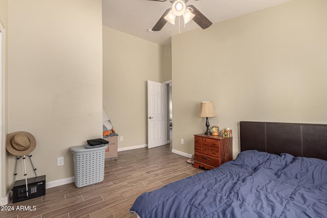 bedroom with hardwood / wood-style flooring and ceiling fan