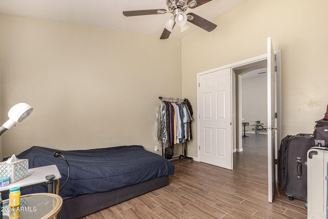 bedroom featuring lofted ceiling, hardwood / wood-style flooring, and ceiling fan