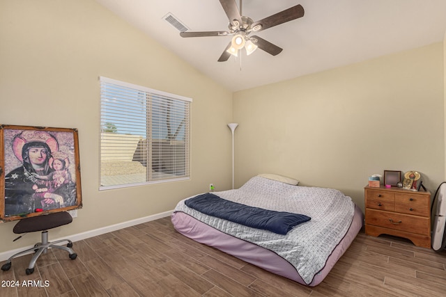 bedroom featuring ceiling fan, wood-type flooring, and lofted ceiling