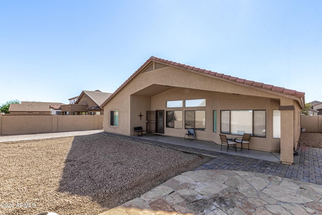 rear view of house featuring a patio