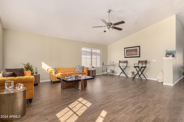 interior space featuring dark hardwood / wood-style floors, ceiling fan, and vaulted ceiling