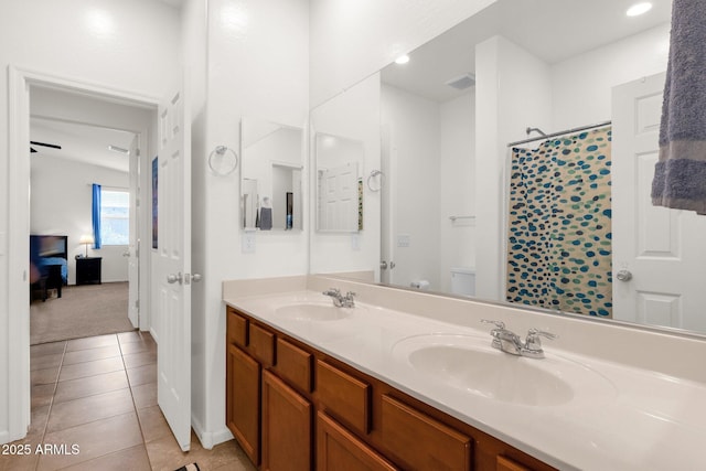 1725 E Chanute Pass, Phoenix, AZ 85040 - full bath with double vanity, toilet, a shower with curtain, tile patterned floors, and baseboards
