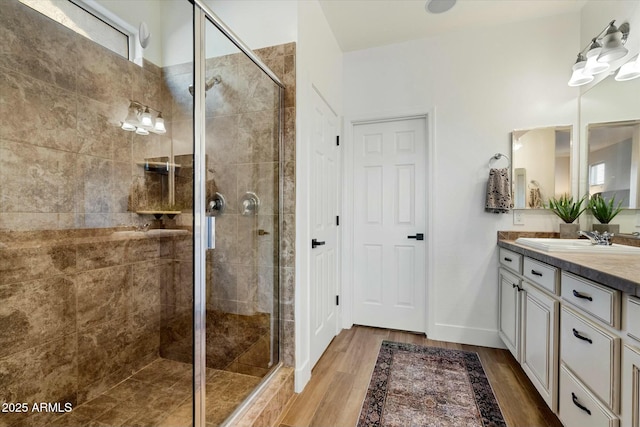 27203 N 78th Ln, Peoria, AZ 85383 - bathroom with a stall shower, wood finished floors, and vanity