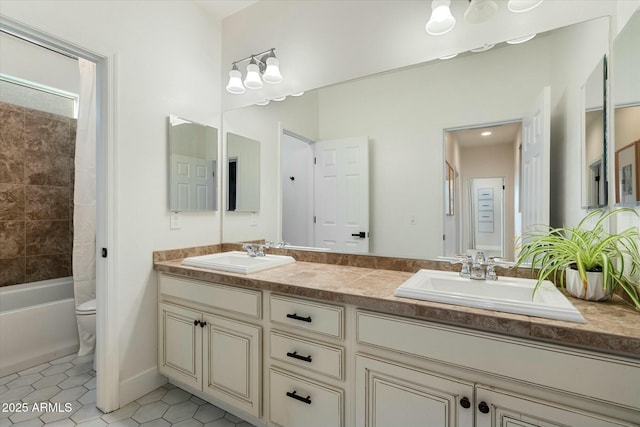 27203 N 78th Ln, Peoria, AZ 85383 - bathroom with toilet, tile patterned floors, double vanity, and a sink