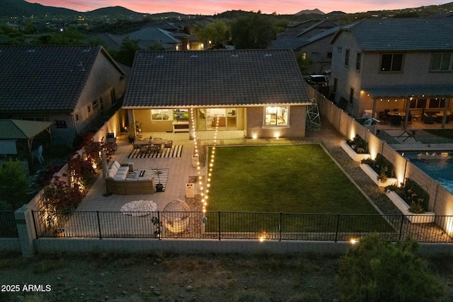 27203 N 78th Ln, Peoria, AZ 85383 - rear view of property with a tiled roof, a fenced backyard, a patio, and a lawn