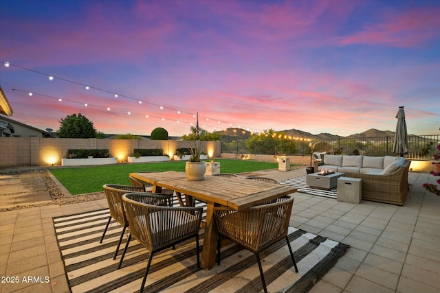 27203 N 78th Ln, Peoria, AZ 85383 - view of patio with an outdoor living space with a fire pit, outdoor dining space, and a fenced backyard