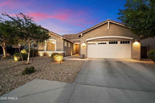 27203 N 78th Ln, Peoria, AZ 85383 - single story home featuring a tiled roof, an attached garage, stucco siding, and concrete driveway