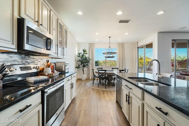 27203 N 78th Ln, Peoria, AZ 85383 - kitchen with a sink, appliances with stainless steel finishes, a chandelier, recessed lighting, and light wood finished floors
