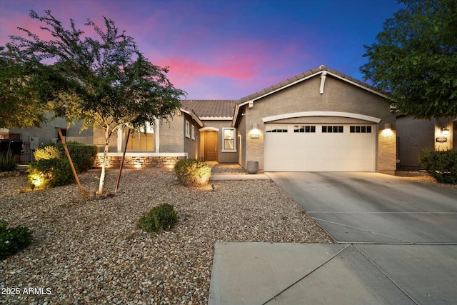 27203 N 78th Ln, Peoria, AZ 85383 - ranch-style home with a garage, driveway, stucco siding, and a tile roof