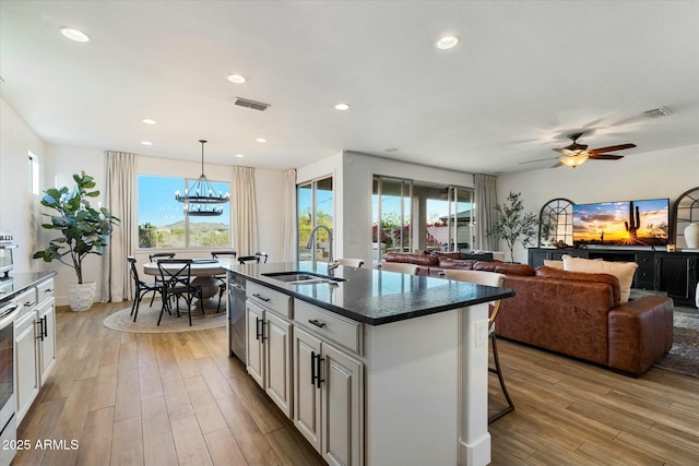 27203 N 78th Ln, Peoria, AZ 85383 - kitchen featuring a wealth of natural light, visible vents, light wood-type flooring, and a sink