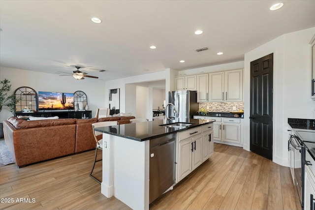 27203 N 78th Ln, Peoria, AZ 85383 - kitchen featuring light wood-style floors, visible vents, ceiling fan, stainless steel appliances, and a sink