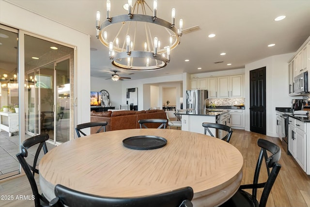 27203 N 78th Ln, Peoria, AZ 85383 - dining space with recessed lighting, visible vents, light wood-type flooring, and ceiling fan with notable chandelier