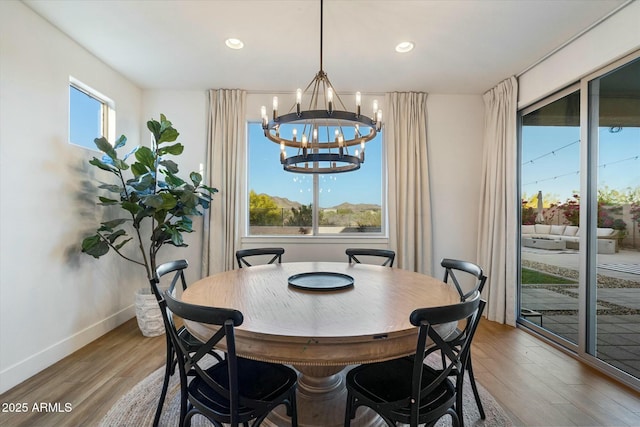 27203 N 78th Ln, Peoria, AZ 85383 - dining space with wood finished floors, a notable chandelier, baseboards, and recessed lighting