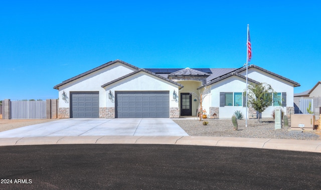 ranch-style home with a garage