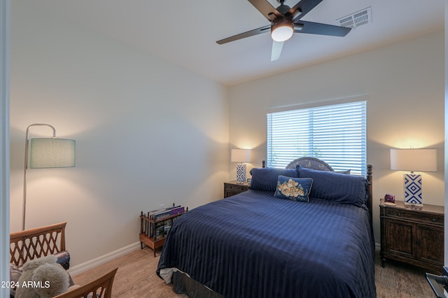 bedroom featuring ceiling fan and light hardwood / wood-style flooring