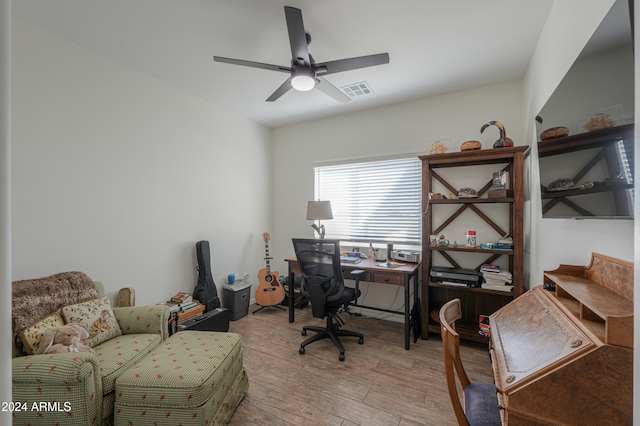 office space with light hardwood / wood-style floors and ceiling fan