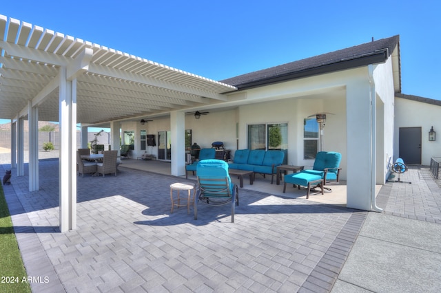 view of patio / terrace with an outdoor living space, ceiling fan, and a pergola