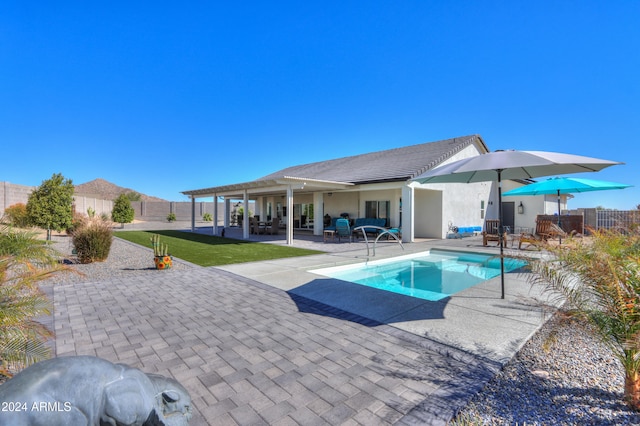 view of swimming pool with a patio area