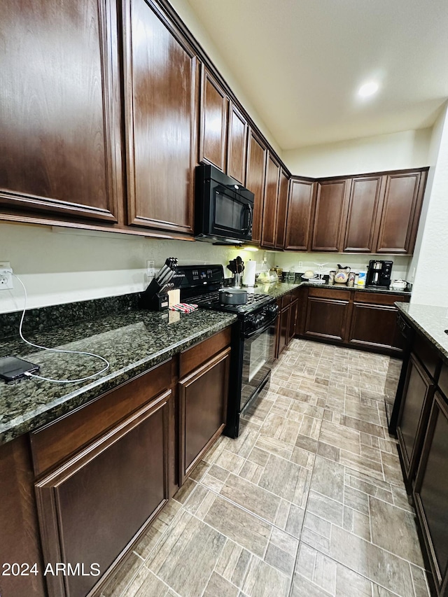 kitchen with light tile flooring, dark stone counters, black appliances, and dark brown cabinetry