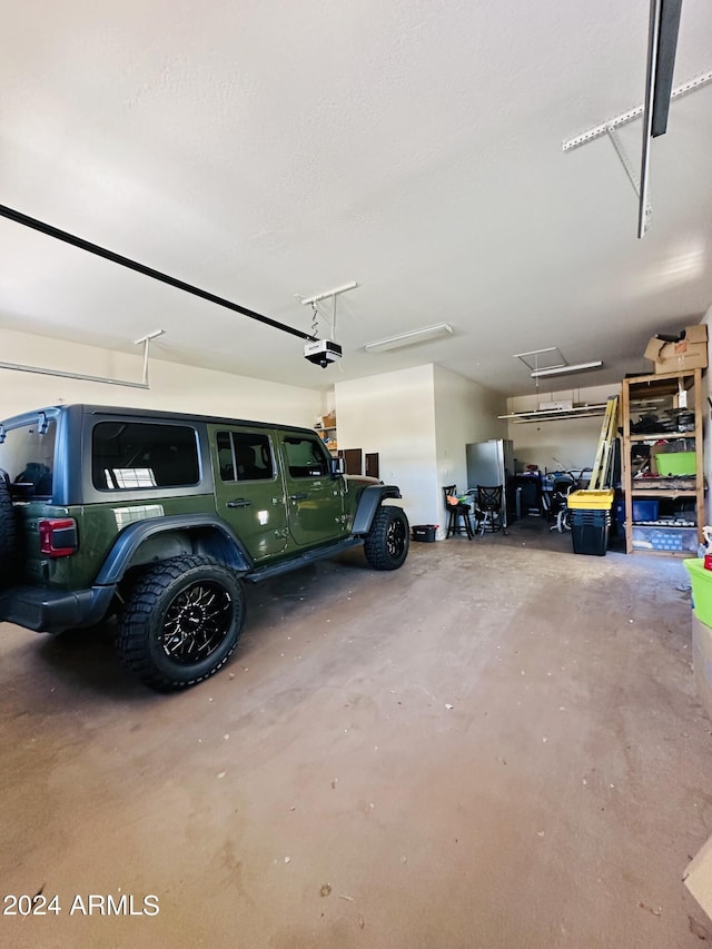 garage featuring a garage door opener