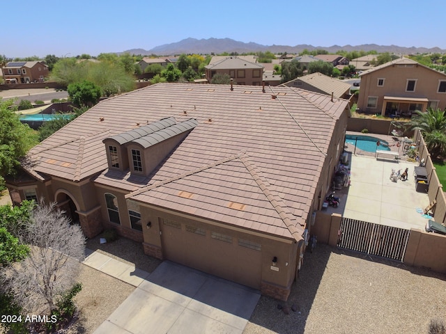 birds eye view of property with a mountain view