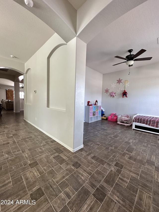 interior space featuring dark tile floors