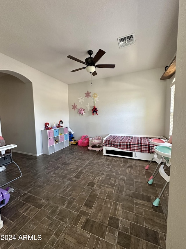 interior space featuring ceiling fan