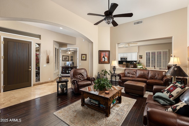 living room featuring hardwood / wood-style flooring and ceiling fan