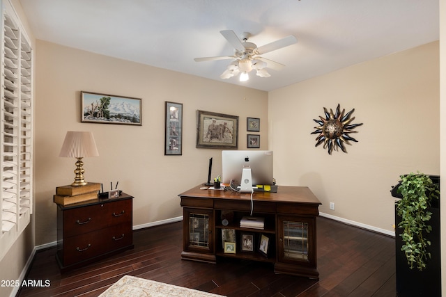 office with dark wood-type flooring and ceiling fan