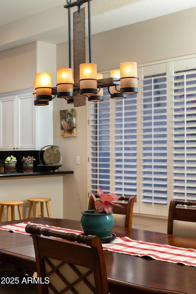 dining room featuring an inviting chandelier and hardwood / wood-style flooring